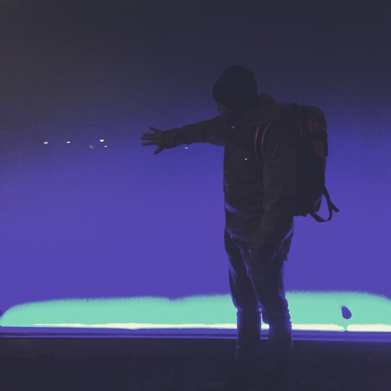 Man’s shadow in night neon light